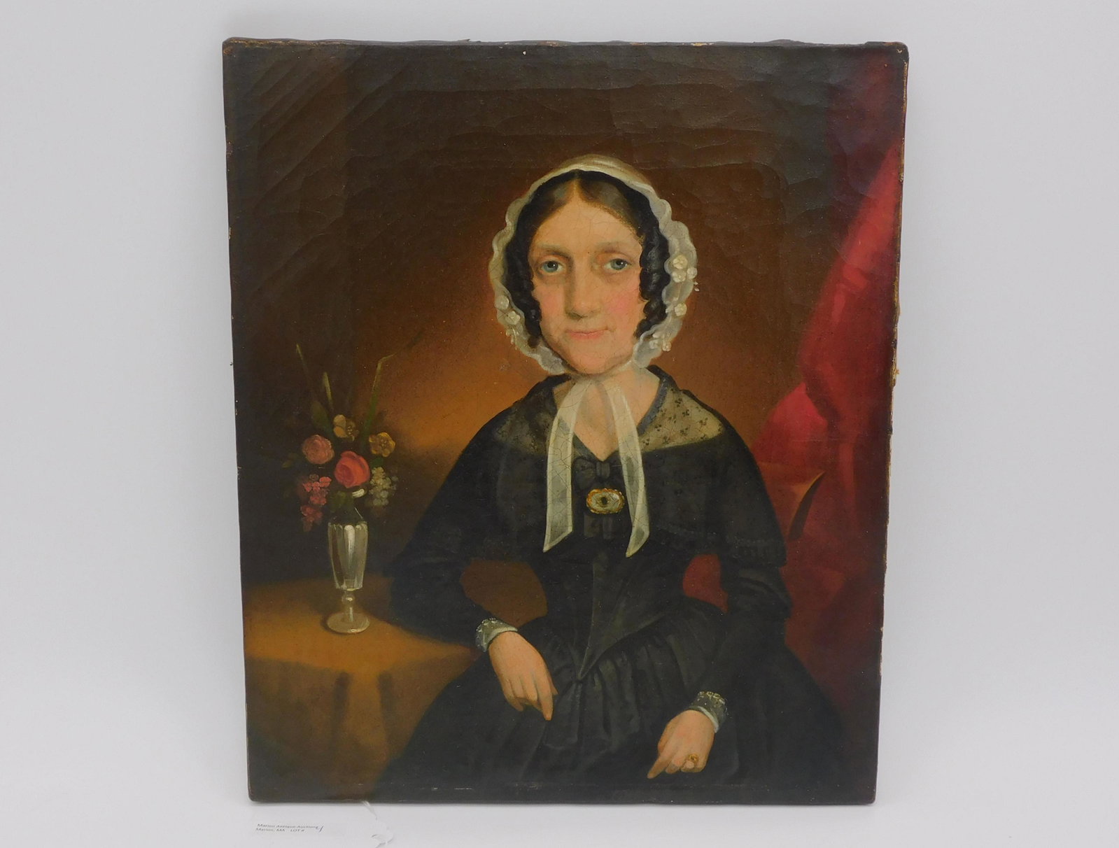 American school portrait of a woman, mid-19th c.: Unframed oil painting on canvas, titled and signed illegibly. 14" x 12". There is some slight craquelure to the canvas, otherwise in good condition.
