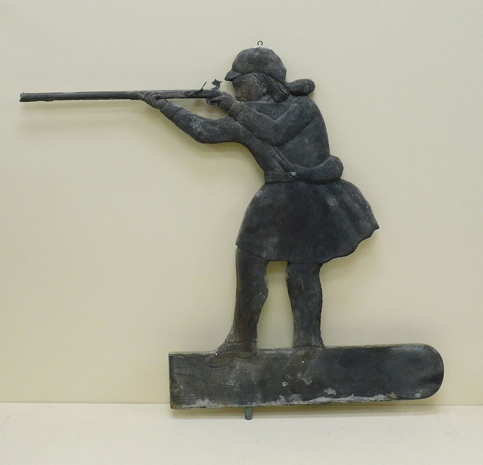 Folk art Daniel Boone weathervane, early 20th c.: A carved and painted wooden weathervane depicting frontiersman Daniel Boone aiming a carved flintlock musket with metal lock and hammer. Attrib. to Manuel Perry (1885-1966). The weathervane depicts a 