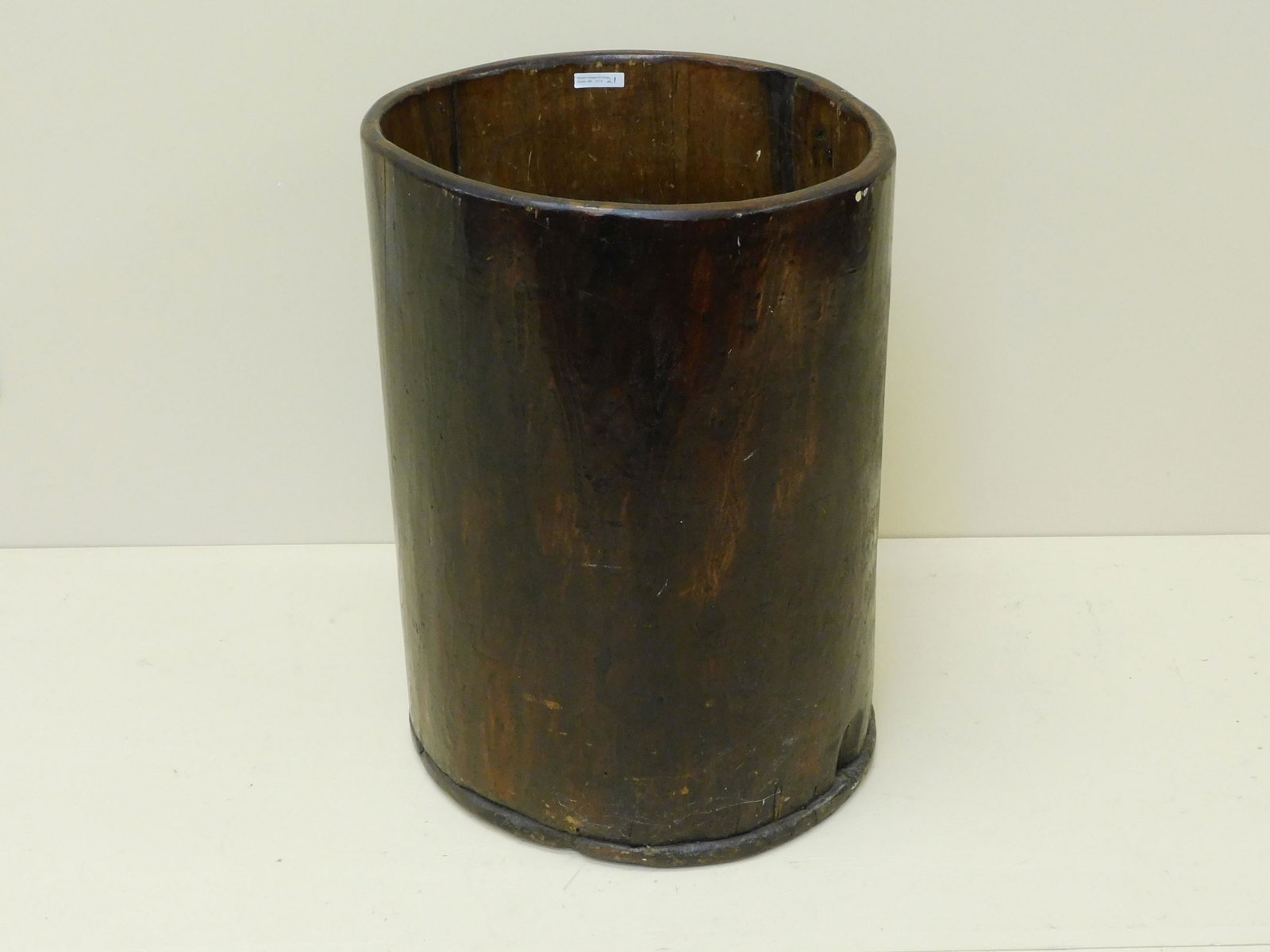 Early New England hornbeam barrel, 19th c.: Hollowed pine tree trunk container, varnished natural finish. 23 1/2" tall, 17 1/2" diameter. It shows crack in the side, but is sturdy, age appropriate wear.