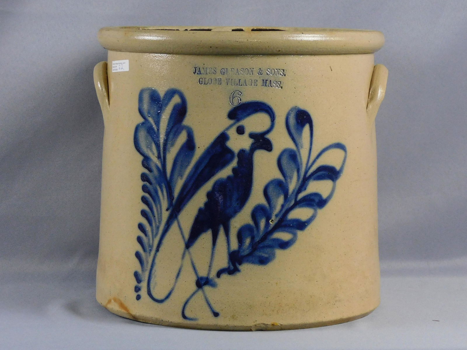 Painted stoneware crock, 19th c. 6 gallons, made: by James Gleason & Sons, Globe Village. Bold bluebird and branch design. 13" high, 14" wide, 13 1/2" diameter. Shows several small chips, overall good condition.