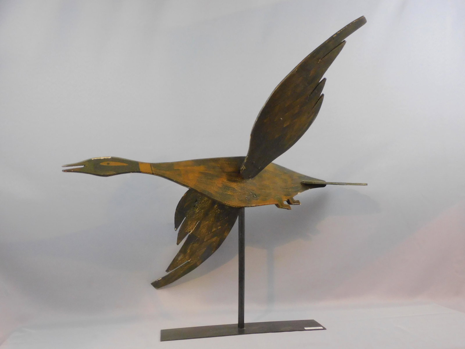 Canada goose whirligig, early 20th c., goose in: flight. 32" long, approx. 29" high, 19" wide. Overall good condition, shows some minor paint loss.