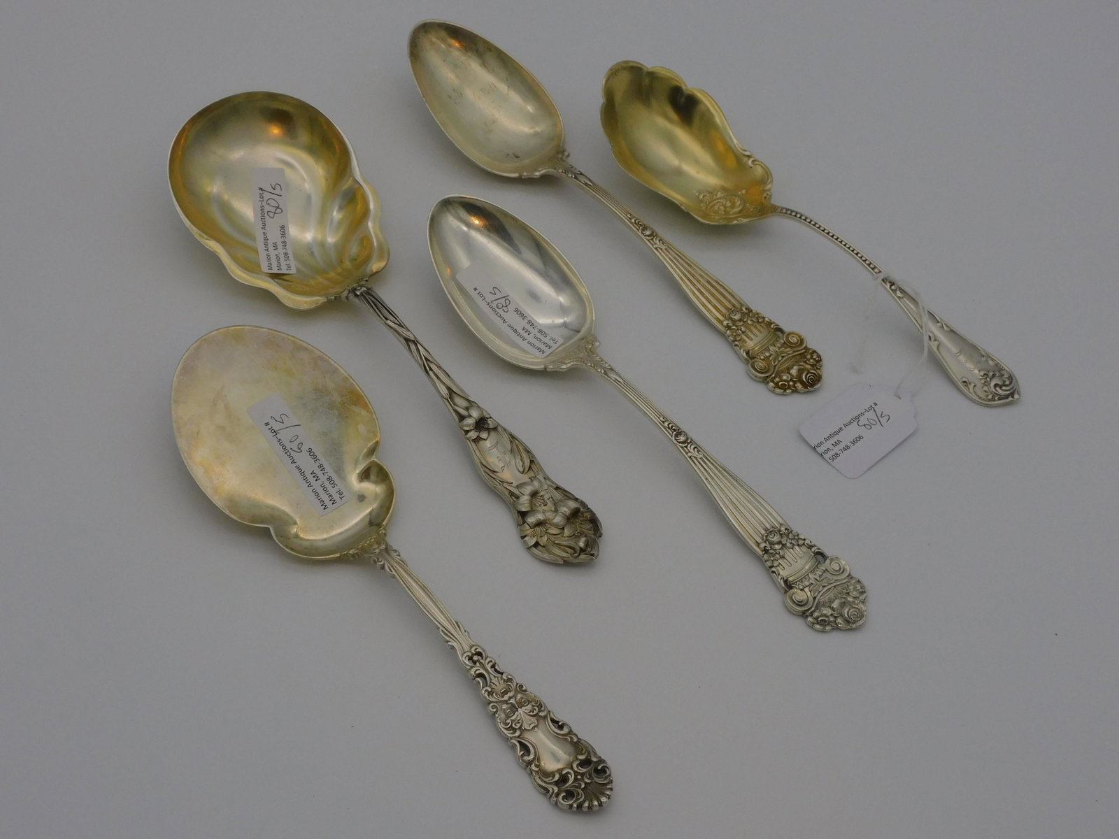 (5) sterling silver serving pieces. To include: a: pair of Towle tablespoons, Georgian pattern, 8 1/4" long. Dominick and Haff serving spoon, 8 1/8" long. Towle serving spoon, 7 1/2" long. Floral decorated serving spoon, 8 3/4" long. 13.45 total ozt.