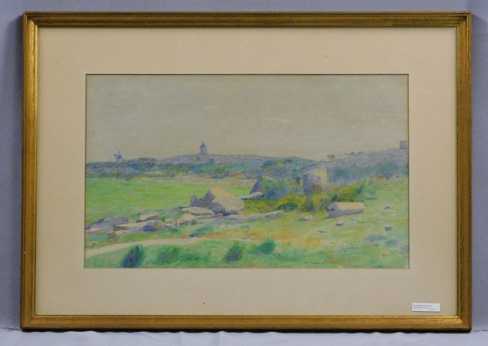 Dodge MacKnight (1860-1950, Providence, RI, MA,: CT, Europe) framed and glazed watercolor painting. Depicts a landscape with a windmill. Signed lower right. Sight size 12" x 20", overall in period gilded frame 20" x 28".