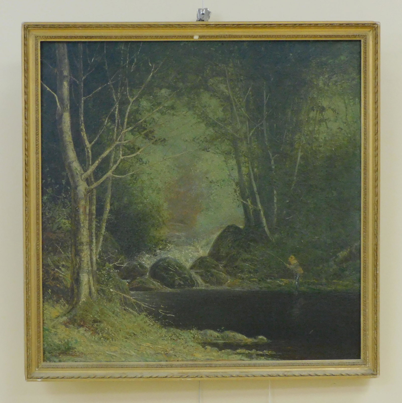 Frederick Mortimer Lamb (1861-1936, MA, born in: Middleboro) oil painting on canvas, depicting a woodland landscape with a stream and man fishing. Signed lower left, dated 1909. Sight size 24" x 24", overall in a period gilded frame 26" x 26". Good 