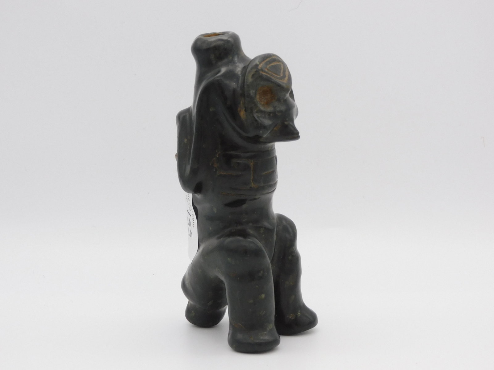 Taino, an excellent example of a Taino cohoba: snuffer depicting a seated birdman (shaman) supported by a zoomorphic figure running down back. The secondary figure's back legs become the shaman's arms and front legs. The nose of the zoomorph offer