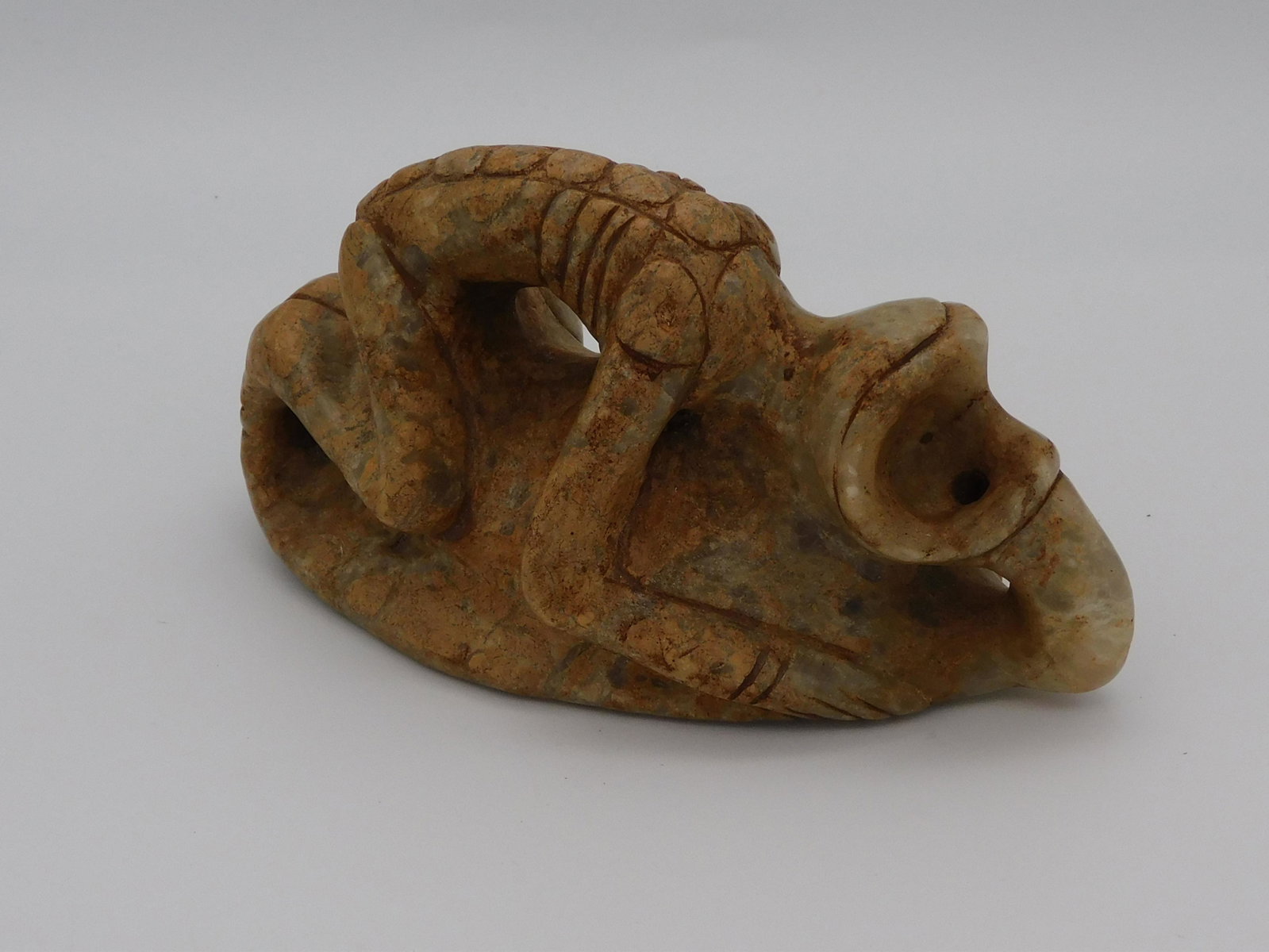 Taino, a remarkable 3 dimensional bird man: (shaman). He is in transition from human to bird alter ego. Birds were shamans' allies and aided them in their cosmic quests. Eyes are pierced and connect to a tube drilled through the bird's nose. Al