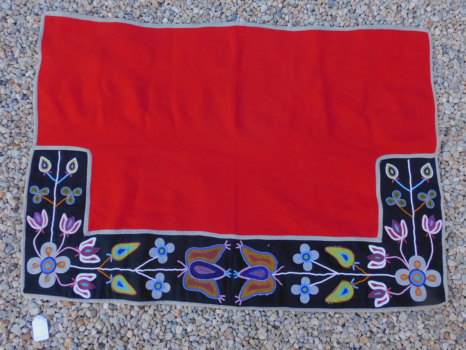 Nez Perce or Crow beaded saddle, plateau.: Geometric floral beading. Red wool with contrasting black border. Good overall condition. 36" x 49".