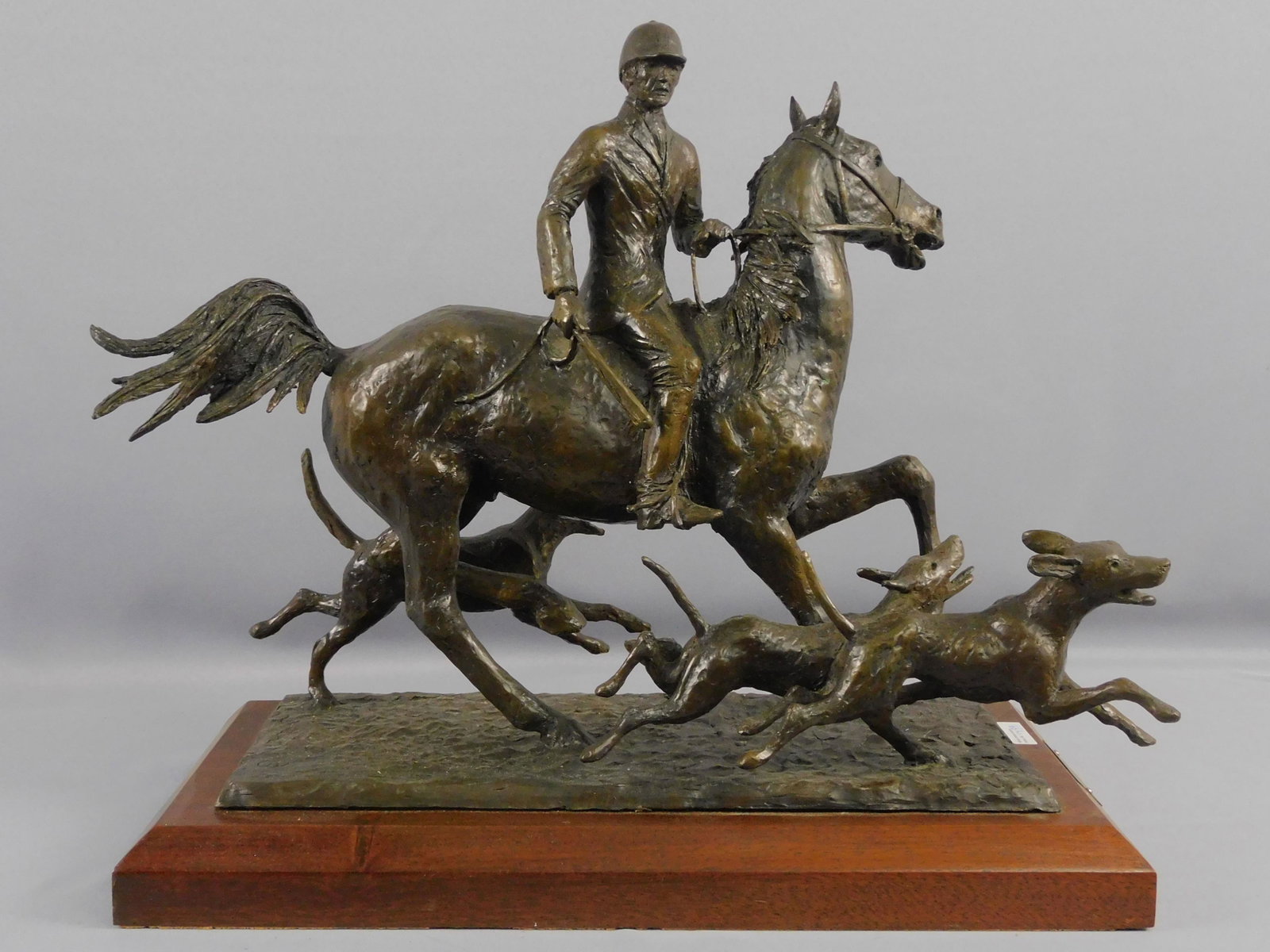 J. Boyd Saunders (b. 1937, SC, TN) bronze: sculpture, titled "Orion's Hounds", casting 1/20. Signed on mahogany base. 15" high, 20 1/2" long, 10" wide. Exhibited at the US embassy and Canada. Provenance: Pinckney Simons Gallery