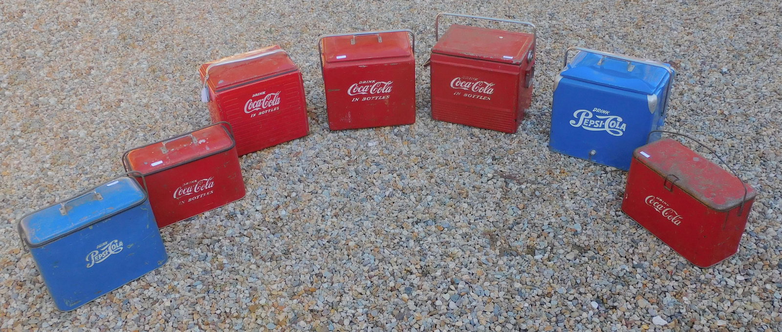 Coca Cola and Pepsi Cola cooler 7 piece lot,: early 20th c. travel coolers, five are Coca Cola, two are Pepsi. Ranging in size from 17" high x 17" wide x 12" deep, to 12" high x 18" wide x 9" deep. Well-used condition. 6 show paint loss and minor