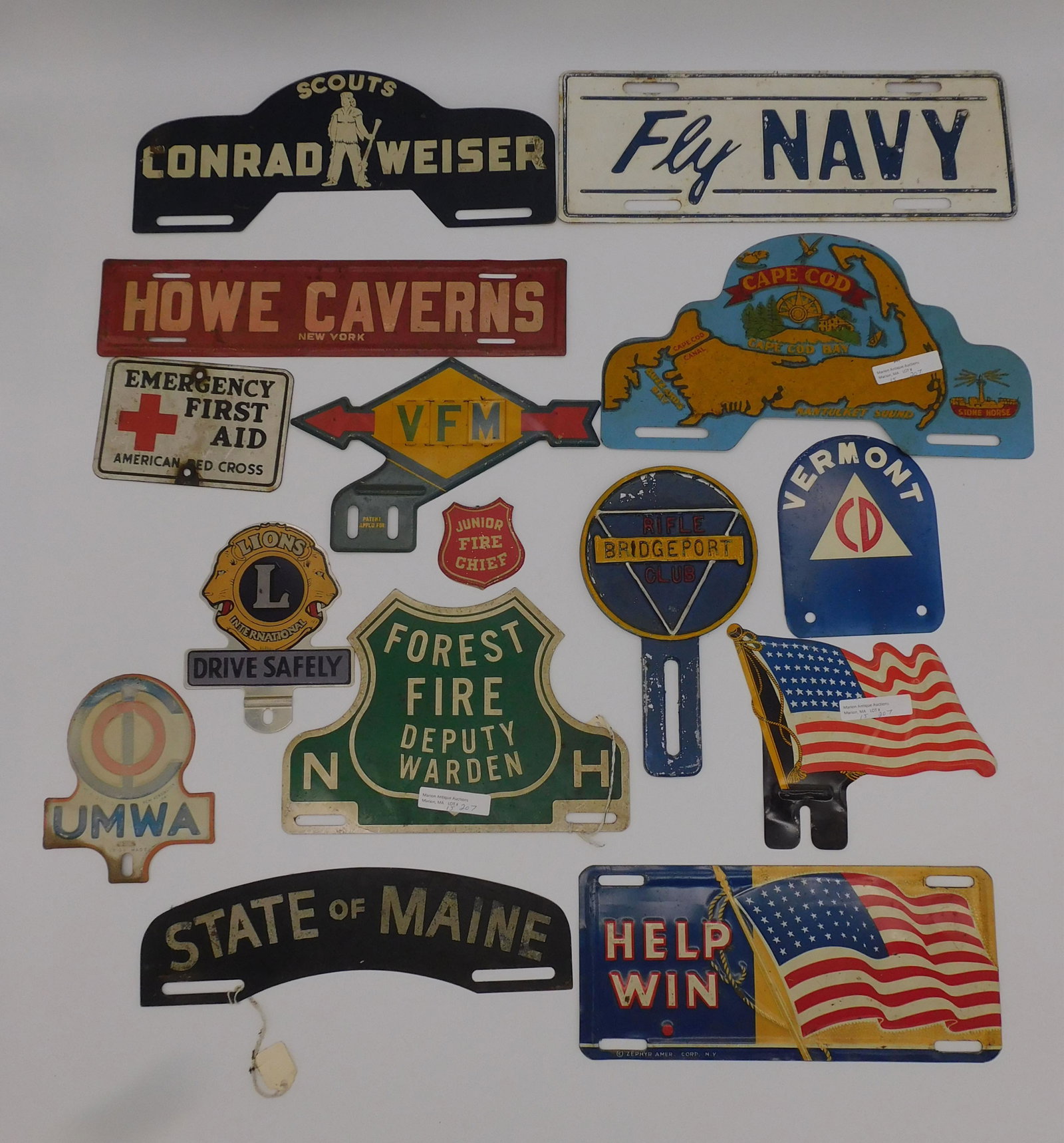 (14) vintage license plate toppers, and one: pinback, to include: Cape Cod (11"), UMWA (5"), Emergency First Aid American Red Cross (4 3/4"), Fly Navy (12"), State of Maine (10 1/2"), Help Win (10"), 48 star American flag (7"), First Fire Deputy