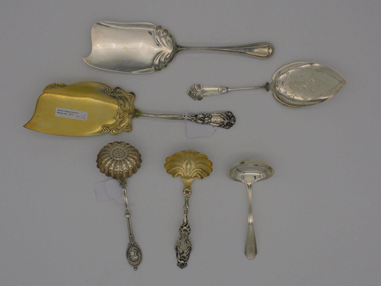 (6) sterling and coin silver serving pieces, to: include: Durgin fish server, Iris pattern, 11 1/2" long, monogrammed. Coin silver engraved pie server, 8 3/4" long. Alvin pie or fish server, beaded design, 10 1/2" long, monogrammed. Whiting gold was