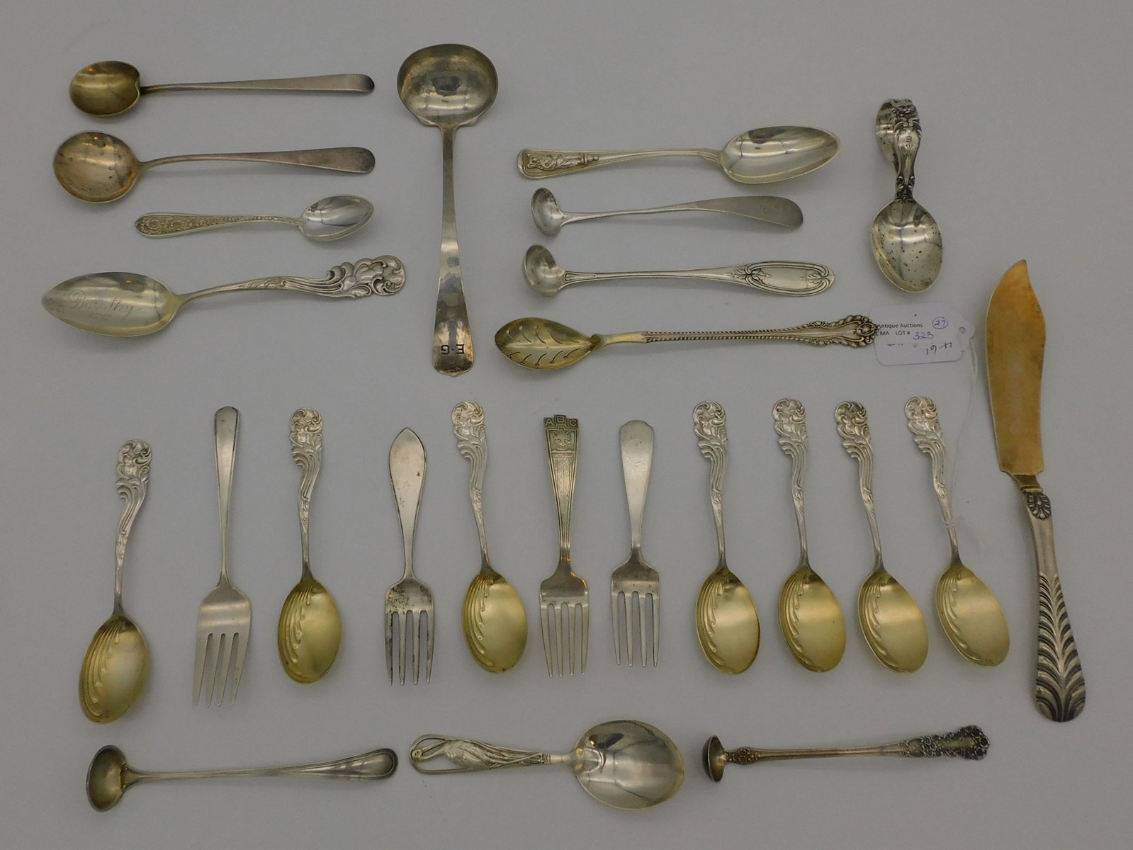 (27) pieces of miscellaneous sterling silver: flatware, primarily spoons, to include: 8 spoons by Frank Whiting, Marquis pattern, seven are 4 1/2" long, one is 6" long. Dominick and Haff butter knife, ribbed shell motif, 7 1/2" long, monogrammed.