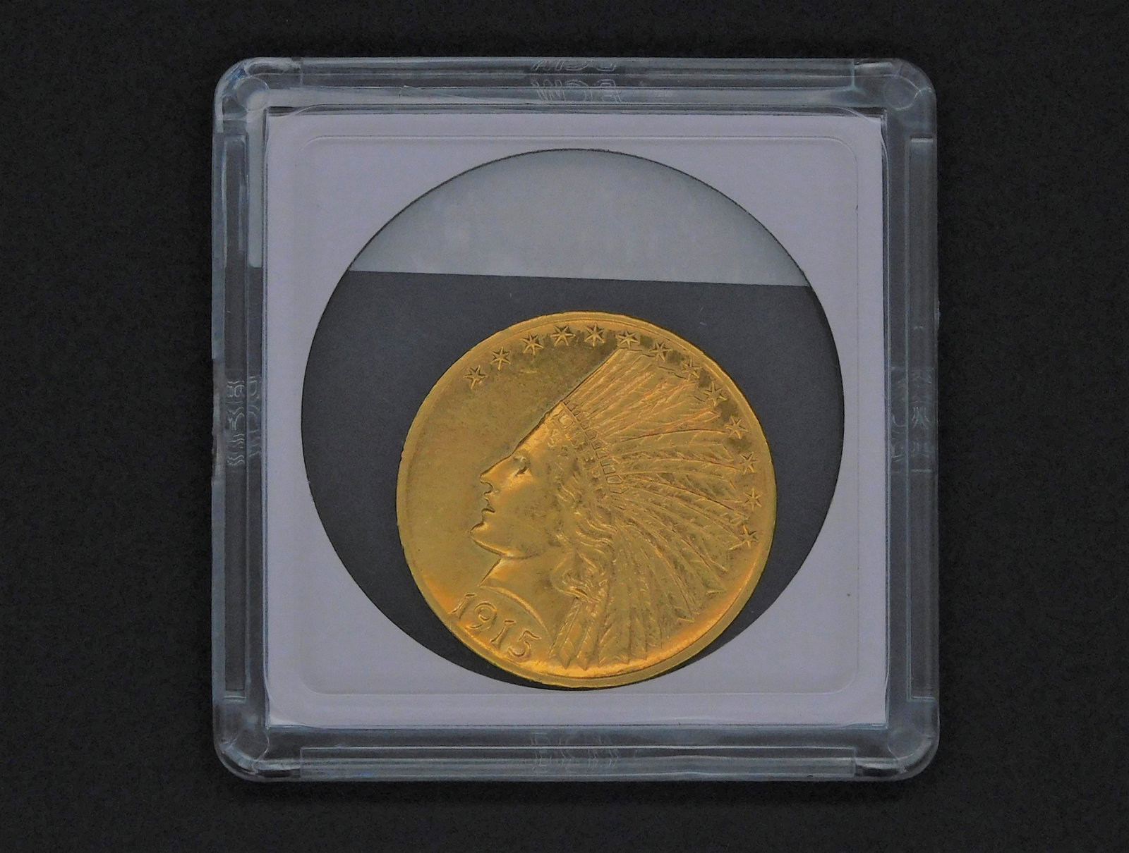 1915 Indian head 10 dollar gold piece. Excellent: overall condition, very slight wear.