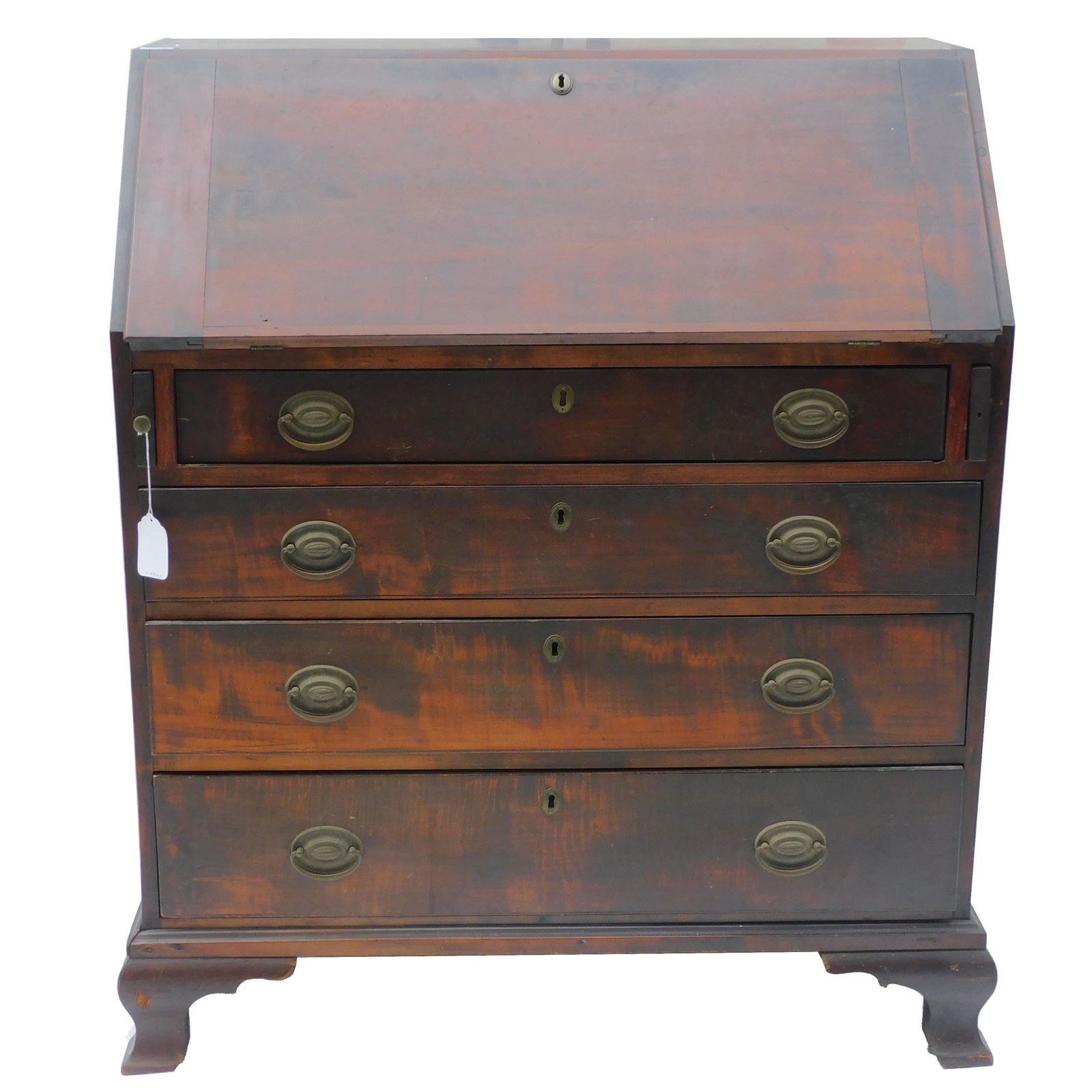 Late 18th c. mahogany slant lid desk, dovetailed: top. Multi-drawer interior. 4 graduated drawers on a replaced ogee base. Old dark finish, later replaced brasses. 44 1/2" high, 37" wide, 22" deep. Missing one pull out knob.