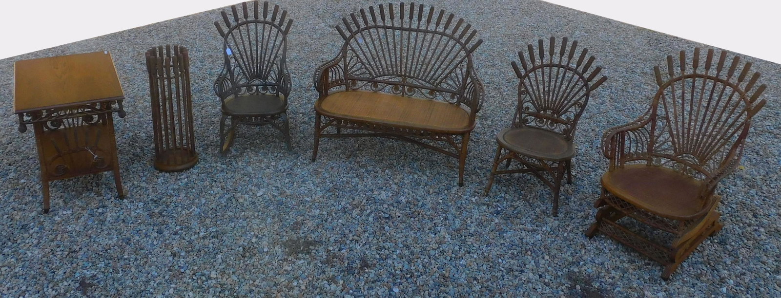 Assembled 6-piece suite of wicker in a rare: cattail design. Ca. 1895, unknown maker. It consists of a settee, 39" high, 44" wide, 20" deep, in original natural finish, very good condition with replaced pressed cane seat and some newer wrapping 