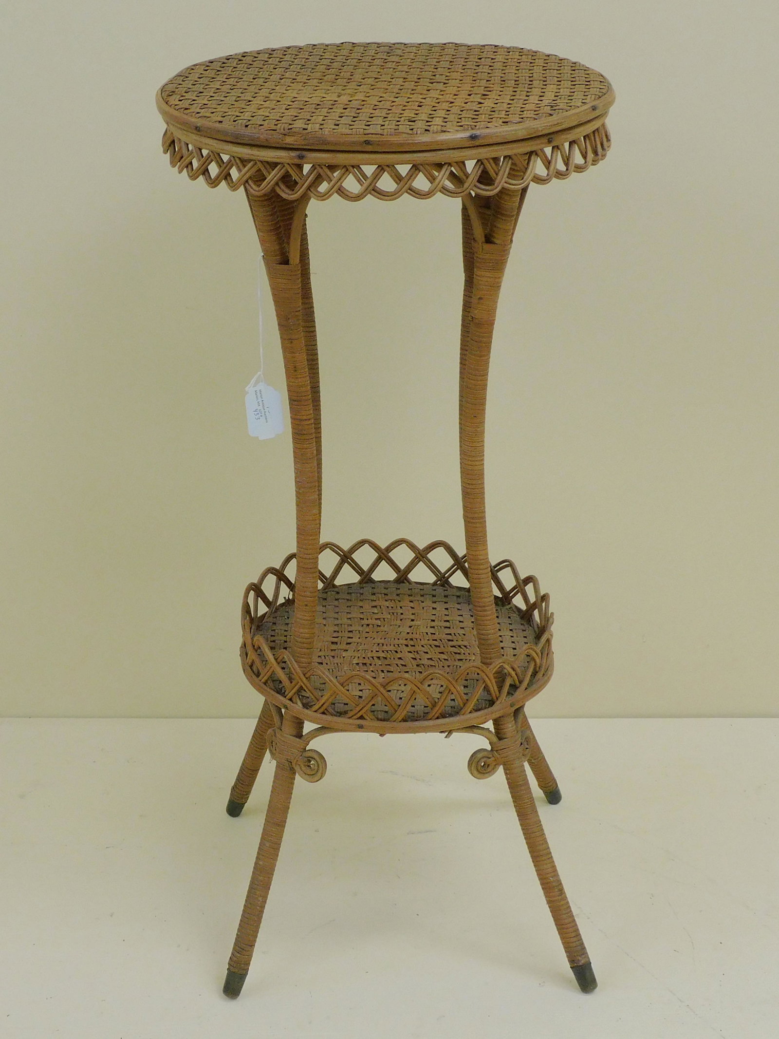 Heywood Brothers and Co. table, ca. 1890.: Original natural finish, round top with bottom. Original factory label under bottom shelf. 29" high, 14" diameter. Excellent overall condition. Provenance: Mary Jean McLaughlin Collection.