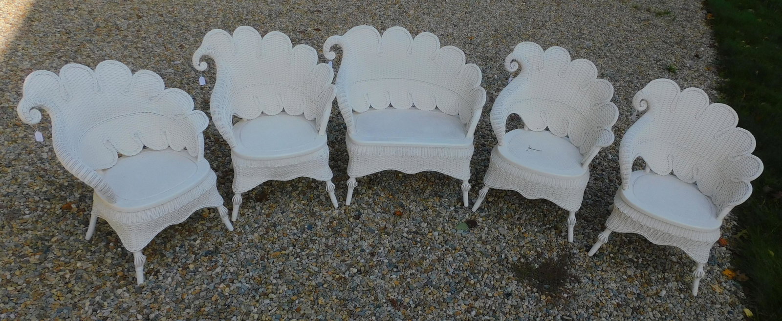 Victorian 5-piece parlor set in a rare leaf: design, ca. 1898. Modern white paint. Consists of a loveseat, 33" high, 34" wide, 18" deep, good condition. Four matching armchairs, 34" high, 26" wide, 18 1/2" deep, 3 chairs are in good condition, 1