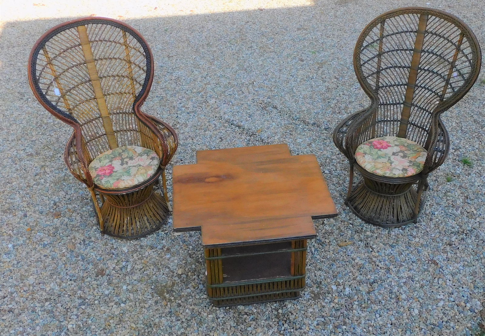3-piece stick wicker set, ca. 1920. To include: a: pair of high back fantail chairs, 55 1/2", 34 1/2" wide, 11 1/2" deep, 18 1/2" seat height. In the original factory finish with some paint loss, missing wrapping cane on one leg. Along with a shaped t