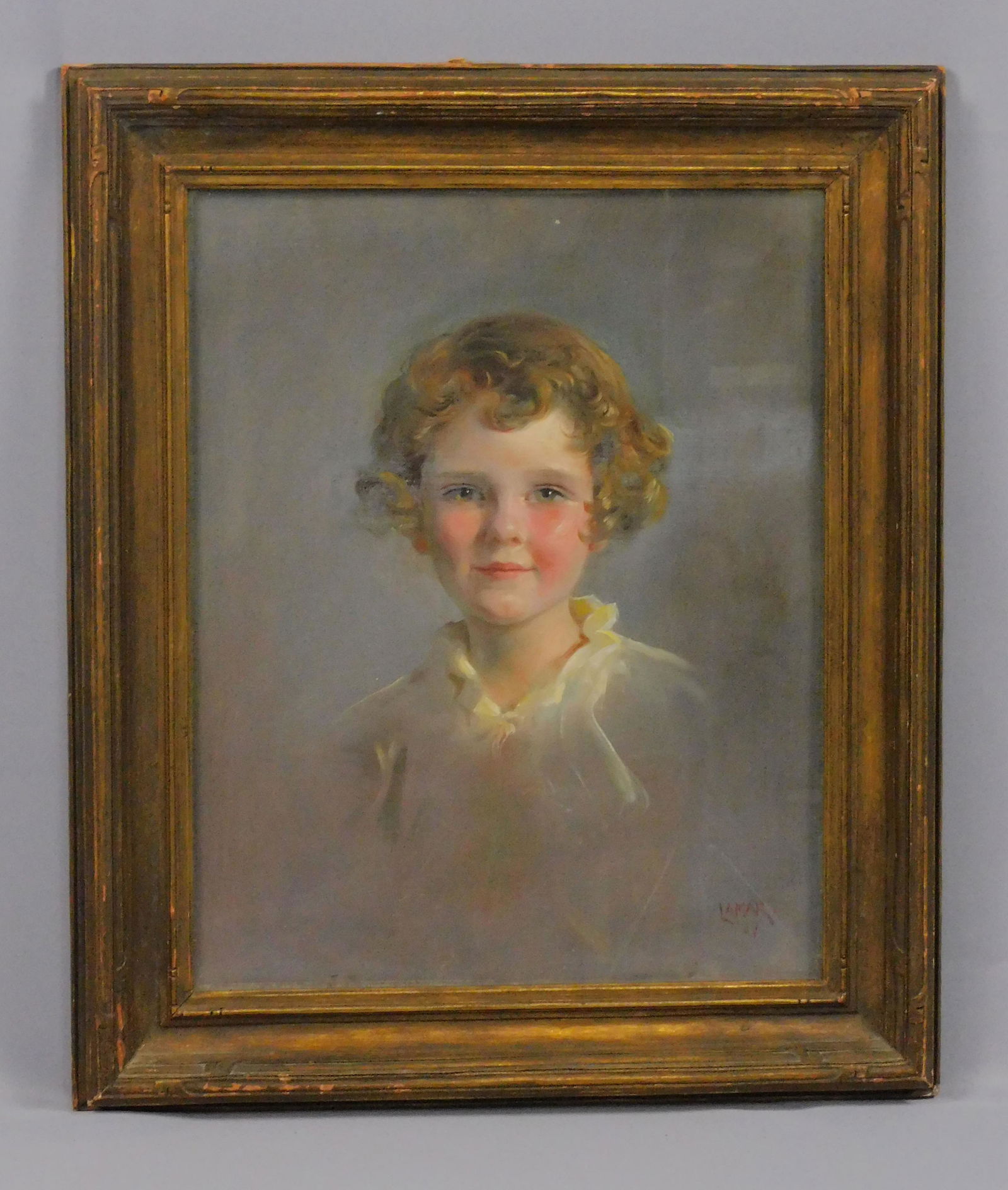Julian Lamar (1893-1967, NY, GA) oil painting on: canvas under glass, depicting a cute young girl with red curly hair. Signed lower right. Frame is in the style of Newcomb-Macklin. Sight size 19 1/2" x 15 1/2", overall in a high quality carved and gi