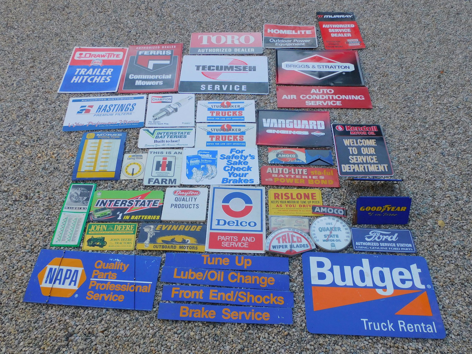 (36) metal advertising signs, related to: automobiles, agriculture, tools, etc. To include: Murray Authorized Service Dealer, Home Life, Briggs and Stratton, Auto Air Conditioning Service, Vanguard Engines, Amoco Tires and Tubes, Kendall Moto