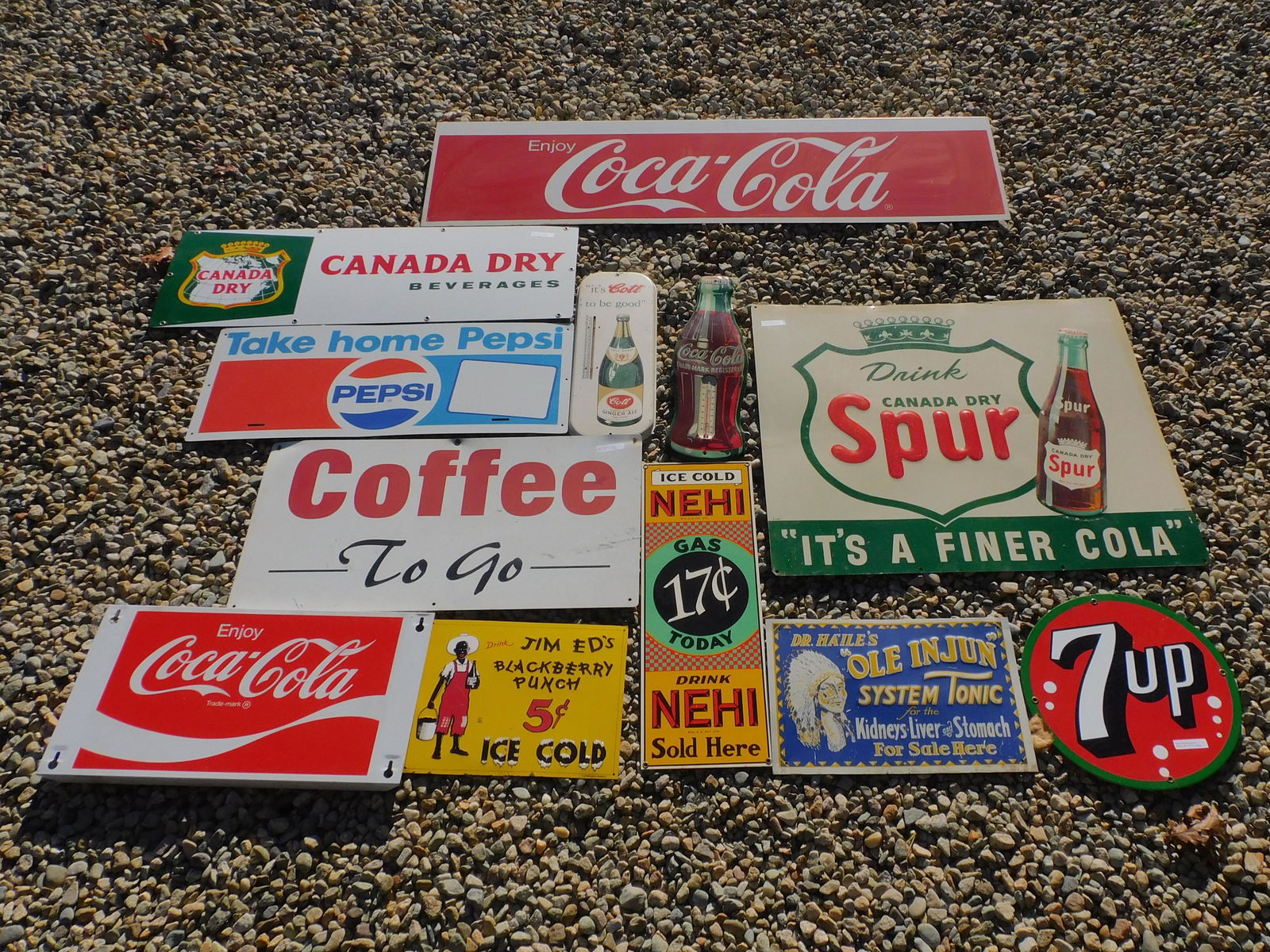 (12) vintage signs, to include: Drink Canada Dry: Spur, 7up (early repro), Dr. Hale's Ole Injun System Tonic (early repro), Ice Cold Knee High (early repro), Coca Cola Thermometer, Cott Ginger Ale, Coffee to Go, Jim and Ed's Blackberry Punch 5 cents