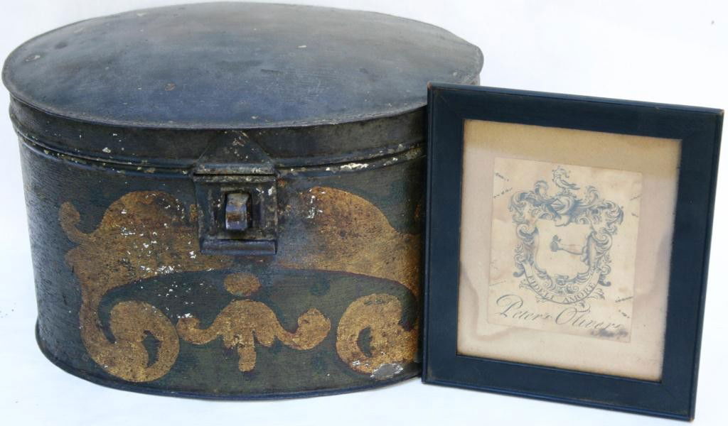PAINTED TOLE COFFEE TIN SAID TO HAVE BEEN TAKEN: FROM OLIVER HALL, MIDDLEBOROUGH, AT TIME OF THE FIRE AT OUTBREAK OF THE REVOLUTION, 6 1/2" HIGH, 9 3/4" LONG, 7 1/4" DEEP, ALONG WITH FRAMED PETER OLIVER COAT OF ARMS, 6 1/4" X 5 1/6"