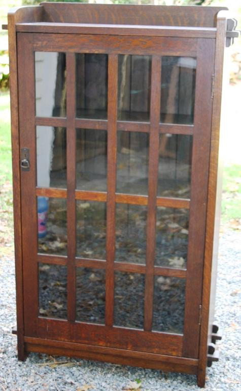 L & J G STICKLEY MISSION OAK BOOKCASE,: CIRCA 1910, 1 DOOR, 16 GLASS PANELS, SIGNED ON BACK, 55" HIGH, 12" DEEP, 33" WIDE, ORIGINAL FINISH