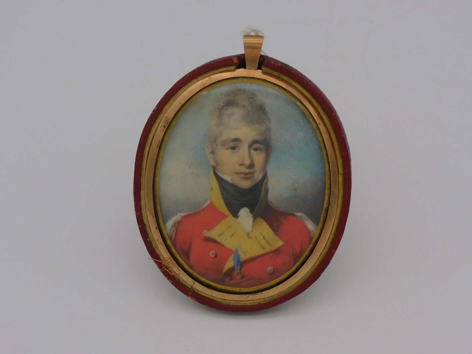Miniature portrait of a British officer, early: 19th c. Well-executed oval portrait in a custom fitted frame with elaborate hairwork and seed pearls at the back. Frame is loose. 3 1/4" x 3" overall.