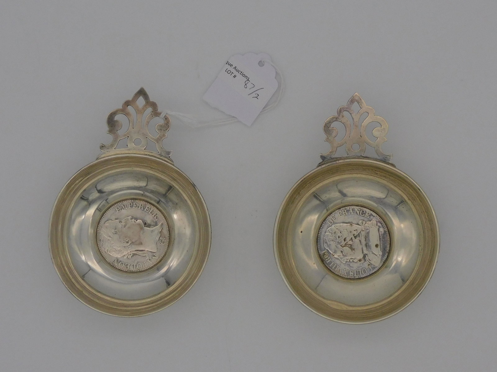 (2) Cartier sterling silver small porringers: inset with early 19th c. French coins. 4.02 ozt total.