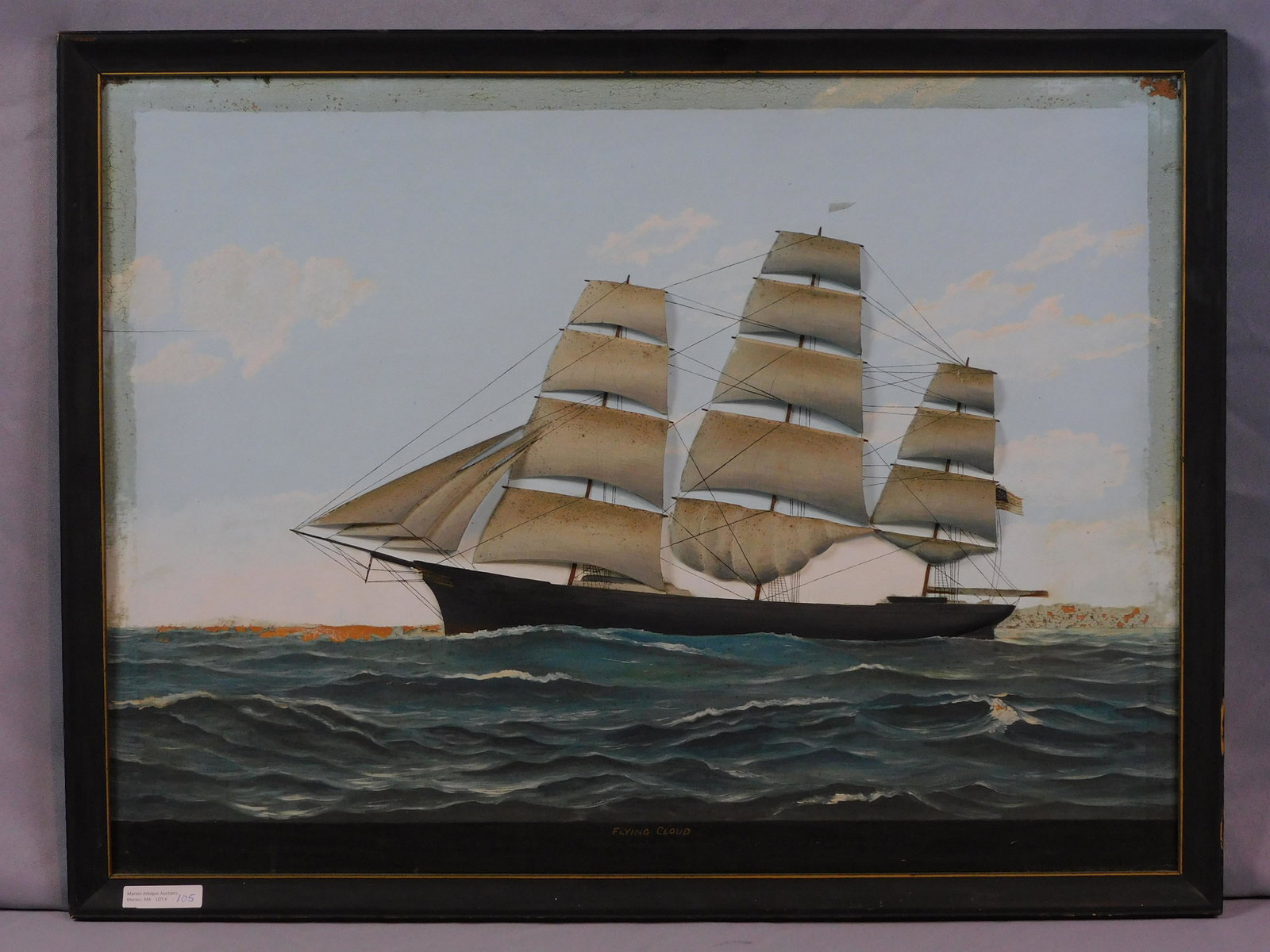 The Flying Cloud, carved and painted relief: plaque. Signed Lloyd H. Thomas (1910-1990, ME). Late 19th c., pine. Shows slight paint loss to sea and landmass. Sight size 17 1/2" x 23 1/2", overall 19 1/2" x 25 1/2".