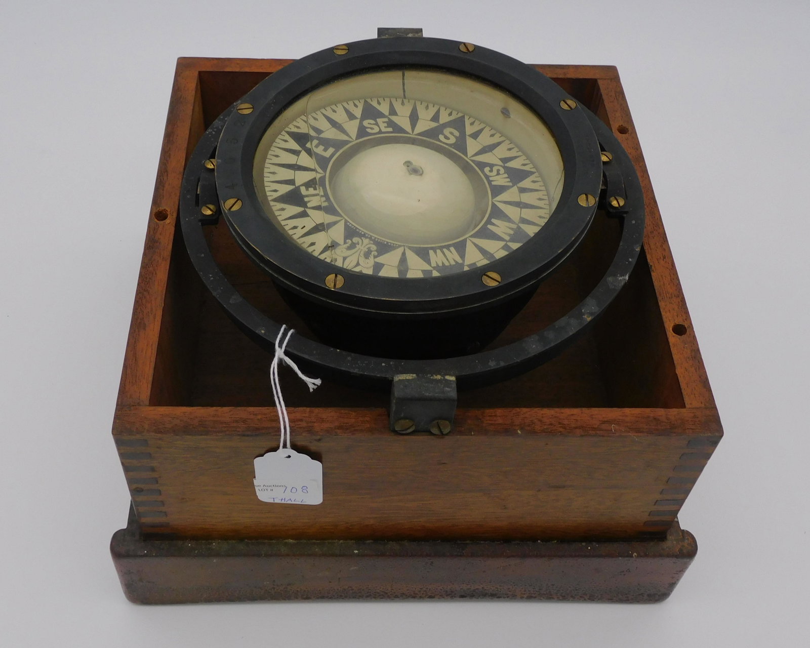 Boxed wet compass, early 20th c. Dovetailed: mahogany case. Made by John Bliss & Co., NY. Compass is 6 3/4" diameter. Overall with box, 7 3/4" x 10 1/4" x 10 3/4".