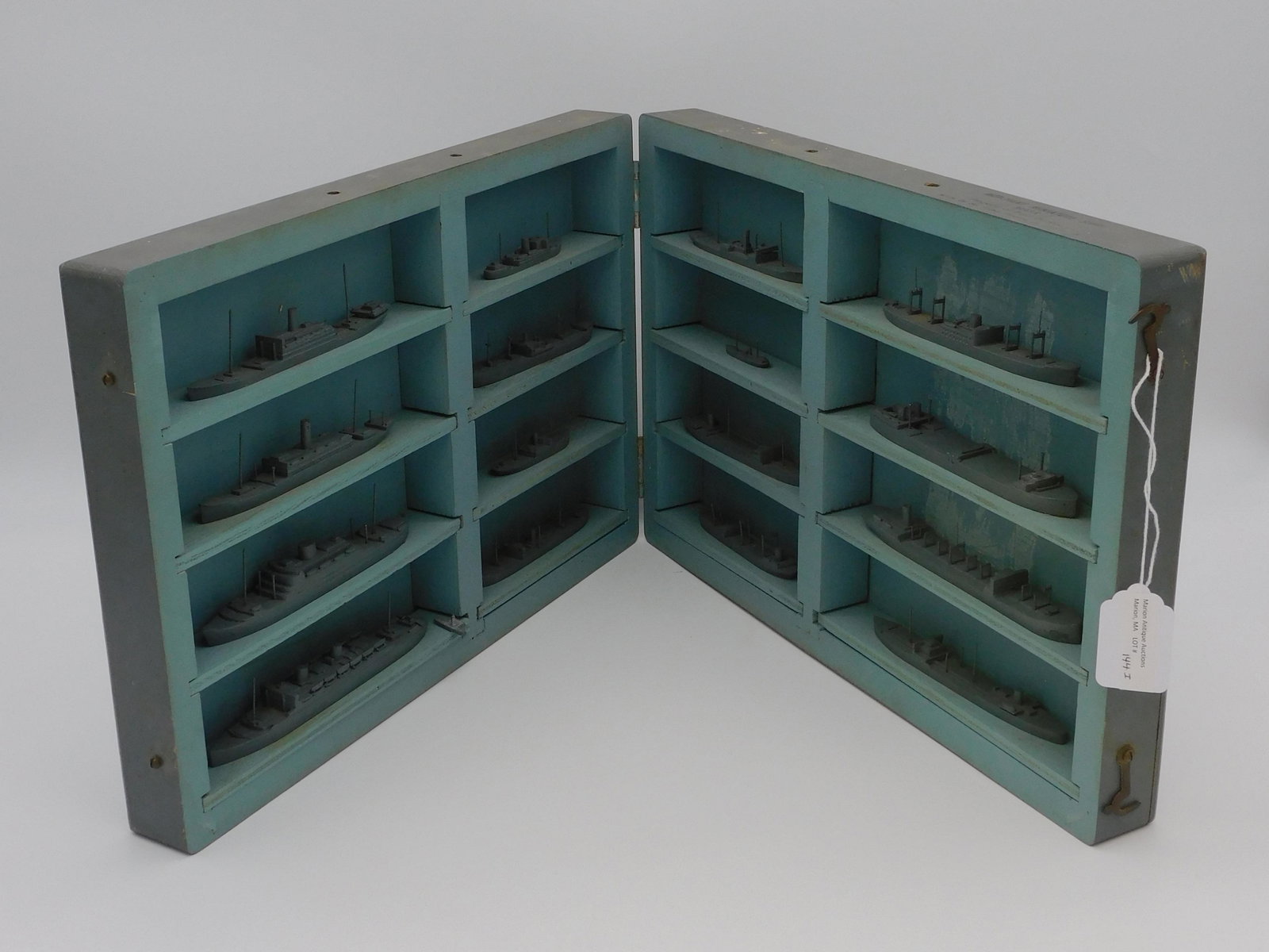 WWII ship recognition models. Ca. 1930s-1940s.: Merchant miniature ships, Mark 1, by South Salem Studios, South Salem, New York. 16 cast metal ships identified on bottom, depicts the ships on the water and displays their silhouette (i.e. not the ke