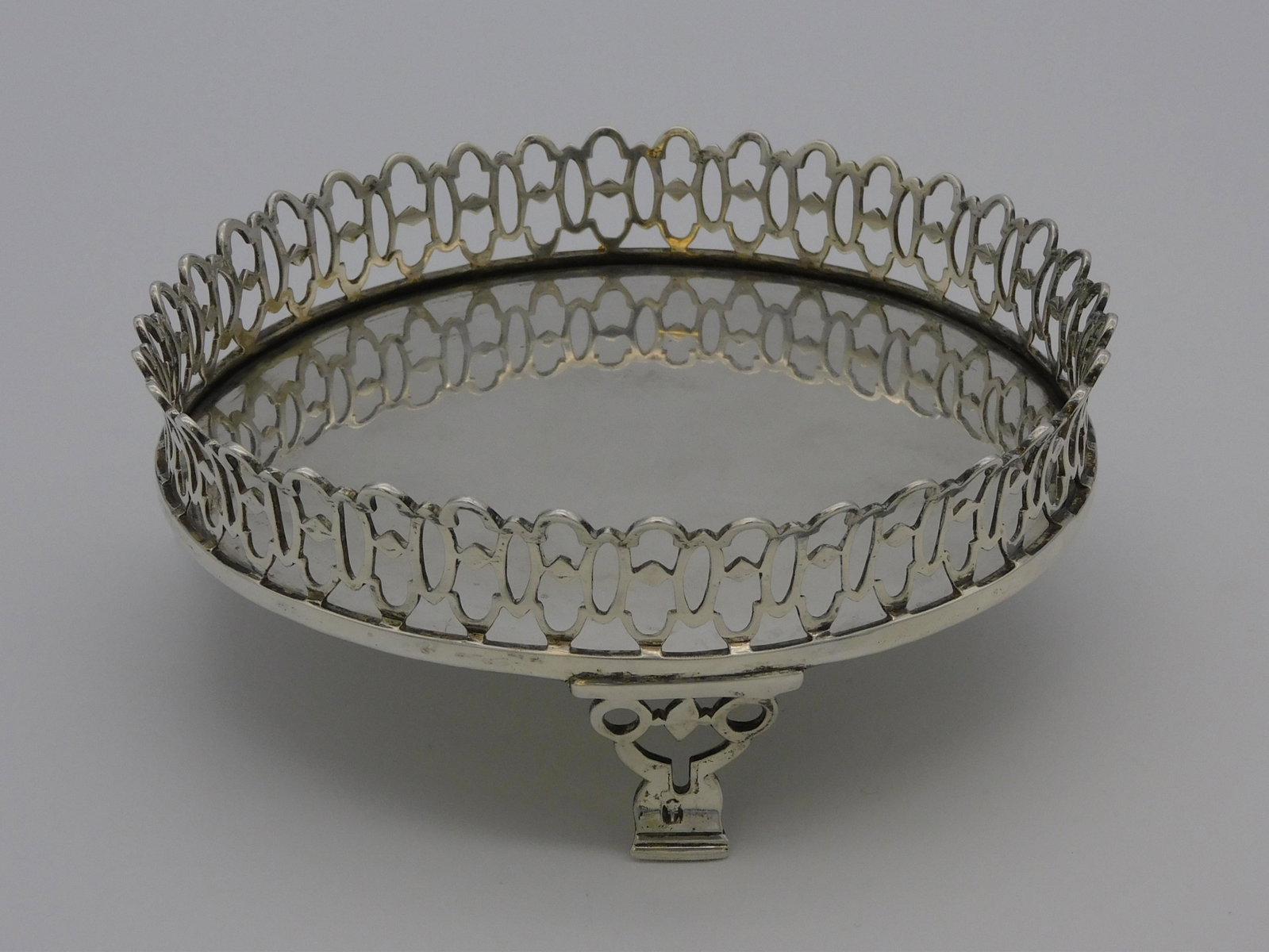 Portuguese silver footed dish, early 19th c. Made: in Lisbon. Reticulated gallery and is hallmarked. 7.51 ozt. 2" high, 5 3/4" diameter. Good condition.