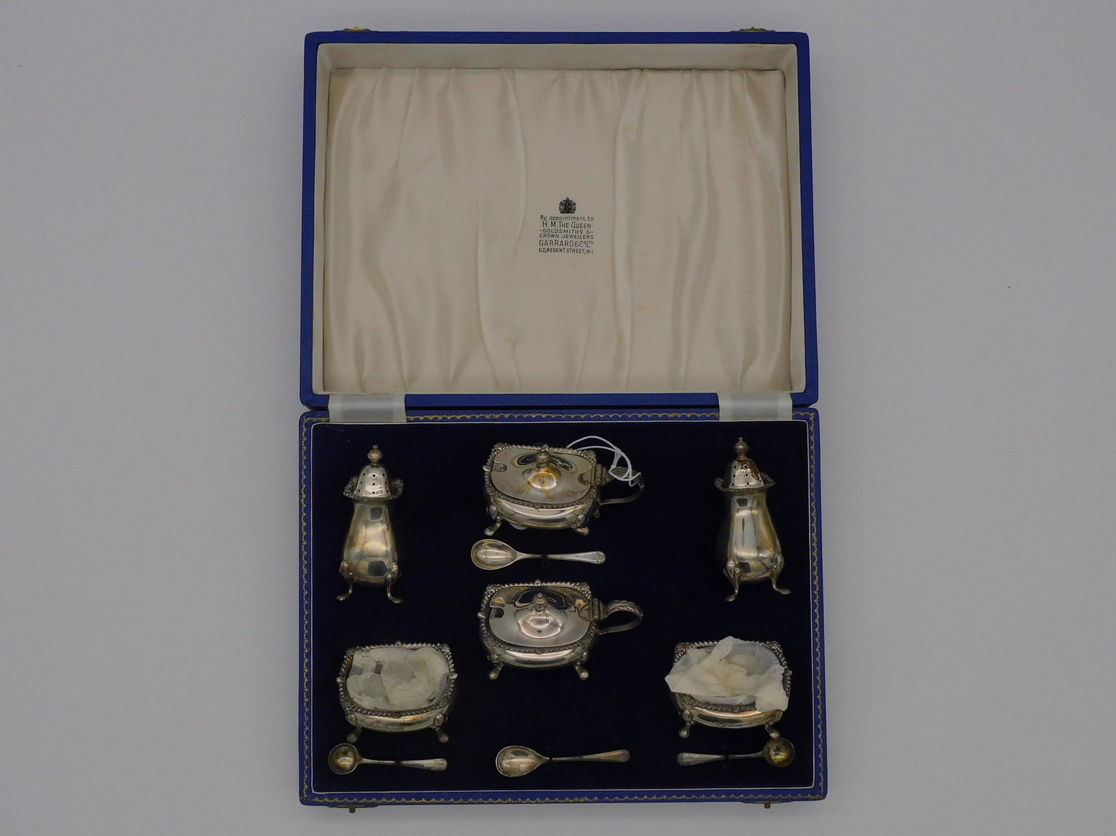 Garrard Ltd. Goldsmiths Silver salt set, ca.: 1962. Made in Birmingham England, 1962 in the original fitted box. 3" high, 10" wide, 7 1/2" deep. Excellent original condition probably never used.