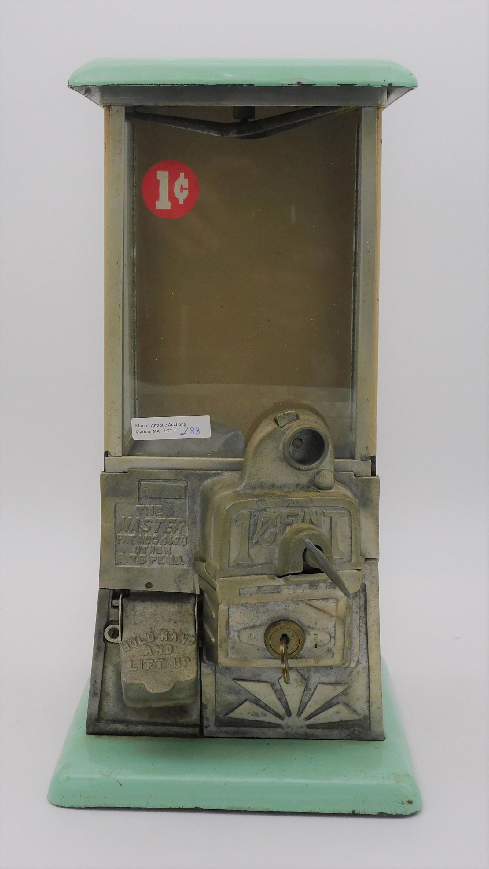 Enamel and tin gumball machine, 1 cent. The: Master, Patented August 14, 1929. 16" high, 8" wide, 8" deep. Unknown working condition. Includes one key, missing key to top.