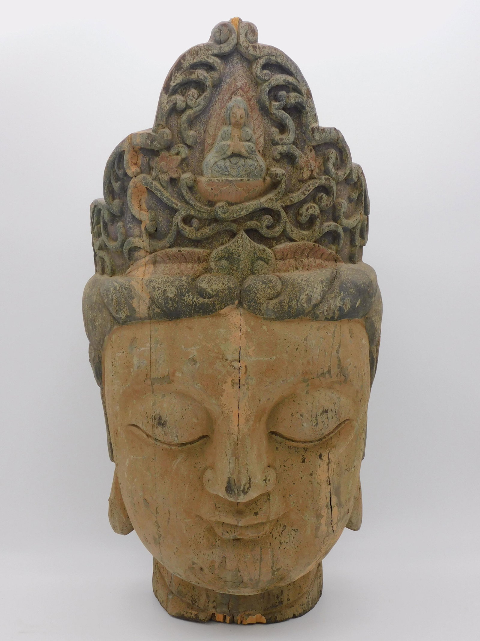Large Guanyin head, 19th c. carved wood and: polychrome painted head. Overall good condition, shows age appropriate wear. 22 1/2" high, 12" wide, approx. 12" deep.
