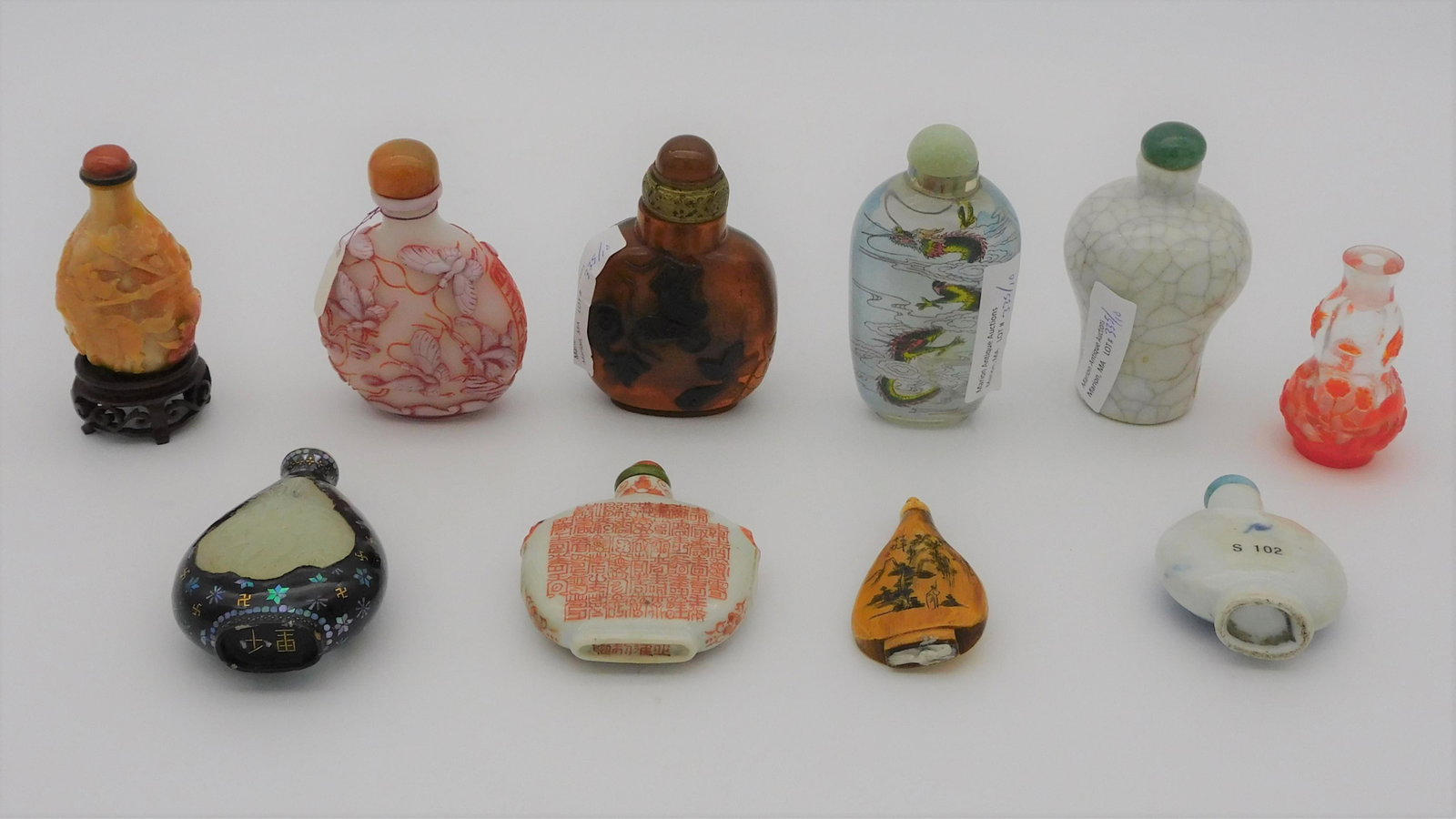(10) miscellaneous snuff bottles, porcelain,: glass, horn, etc. Ranging in height from 2 1/4" to 3 1/4".