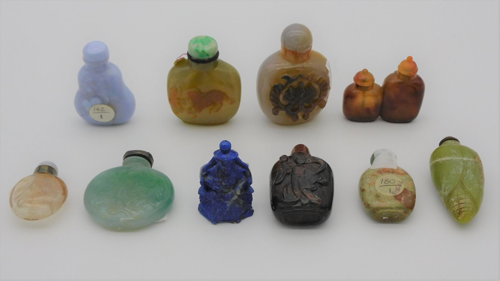 (10) hardstone snuff bottles, carved emperor,: some are relief carved, doubles, etc. Ranging in height from 2" to 3 1/4".