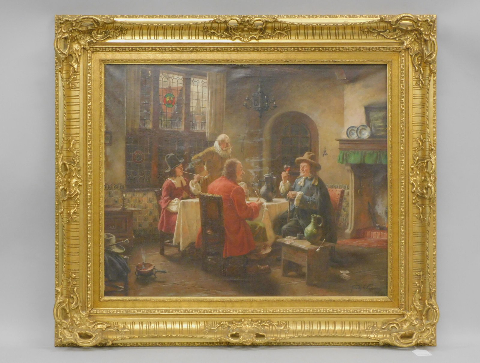 Fritz Wagner (1896-1939, Germany) oil painting on: canvas, genre scene depicting a 17th c. style Dutch interior with four gentlemen carousing at a table. Signed lower right. Sight size 27 3/4" x 33 3/4", overall with period ornately carved and gilded
