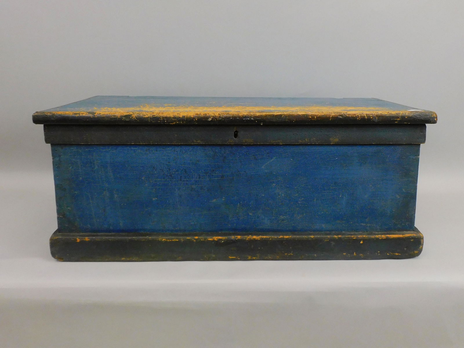 Seamen's Chest. Early 19th century. The chest is: pine and has dovetailed, construction and blue and black painted finish. Possibly replaced wrought iron strap hinges. The chest has exceptional rope painted Beckett handles. With painted ringlets. Car