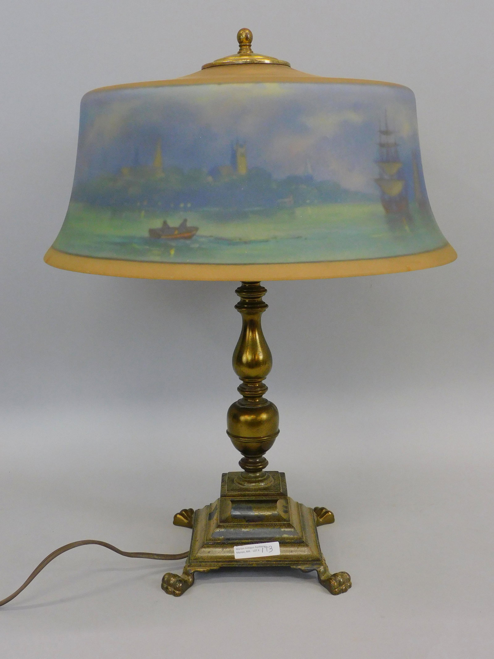 Pairpoint lamp, circa 1915. Reverse painted shade: with scene of Fairhaven, the school, the Unitarian church, sailboats and rowboats in the harbor. Shade is signed on rim Pairpoint Company, as well as C. Durand. Shows several minor repaired chips. Bas