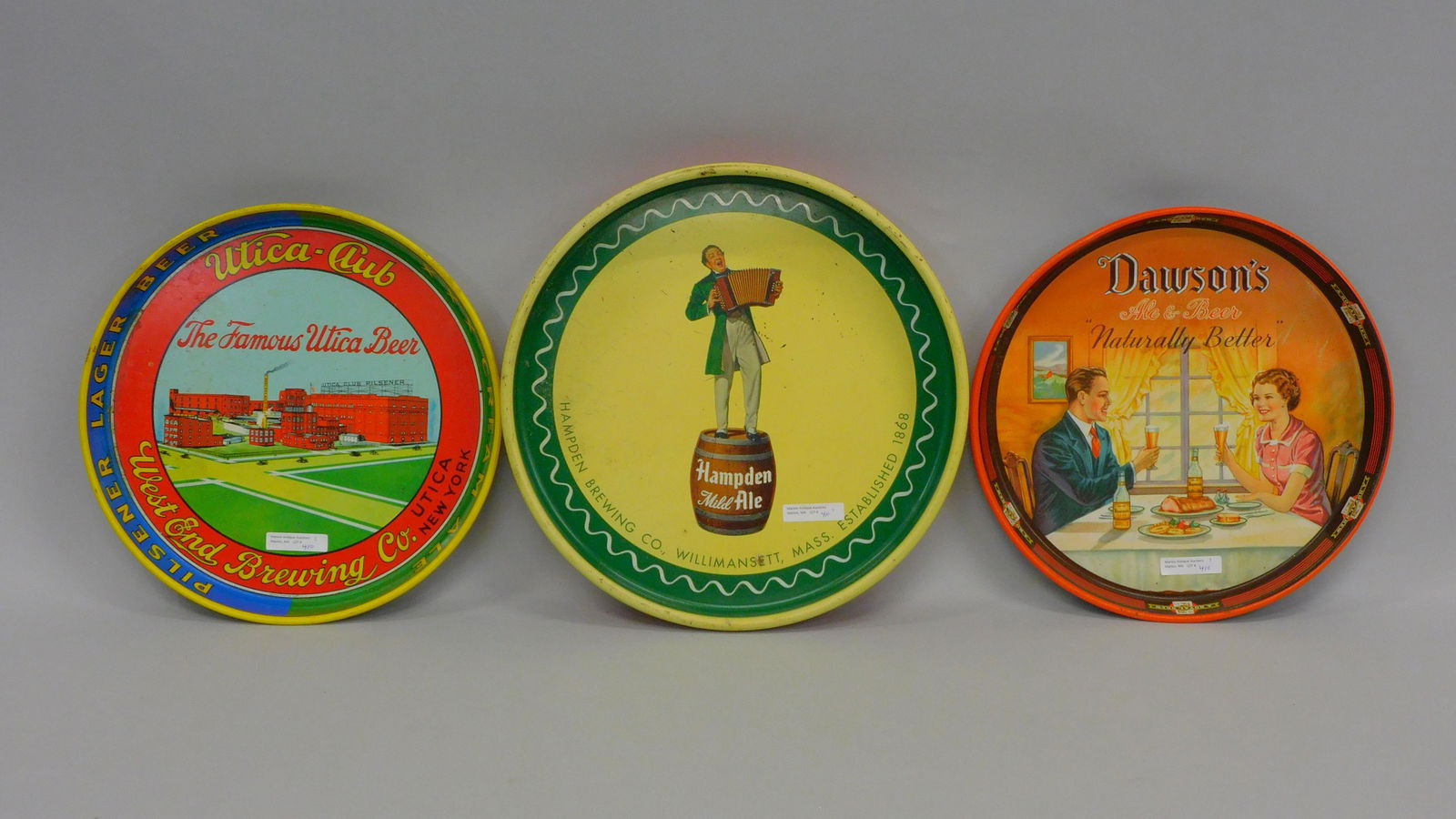 (3) vintage beer trays, to include: a Dawson's: Ale & Beer, "Naturally Better", nice litho tin of a happy couple sitting at the dinner table with beer, 12" diameter. Utica Club, "The Famous Utica Beer", Lager beer and cream ale, 12" diameter. Hampt