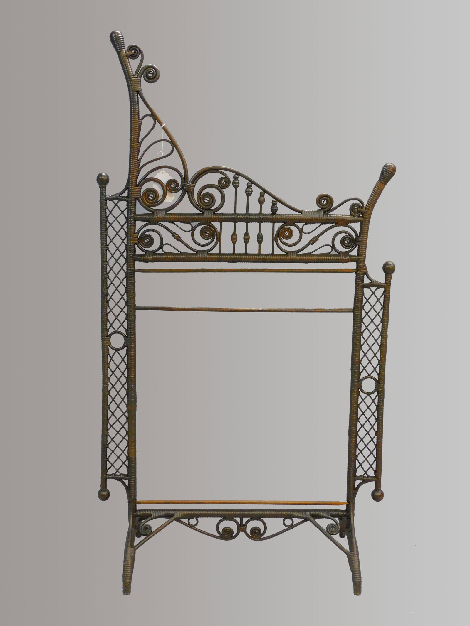 Rare late 19th c. Victorian wicker towel rack.: Natural finish, overall good condition. 50" high, 27" wide, 11" deep. Provenance: Mary Jean McLaughlin collection.