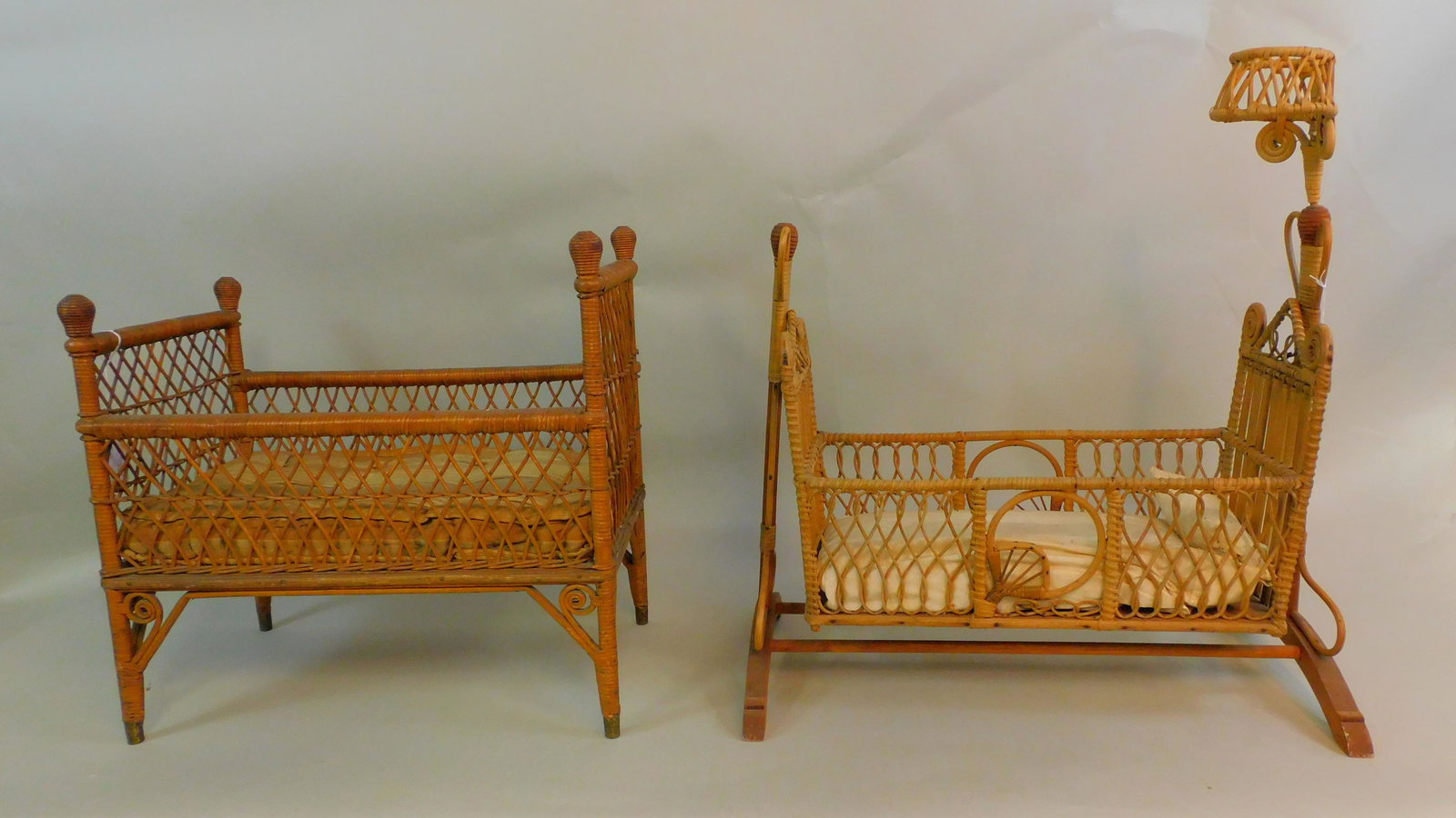 (2) pieces of Victorian wicker doll furniture, to: include: a doll bed ca. 1900, original natural finish, original horsehair mattress, overall good condition shows several small minor breaks, 20" high, 13 1/2" wide, 20 1/2" long. Along with a swinging