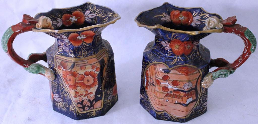 PAIR OF MASON IRONSTONE PITCHERS, 19TH: CENTURY, RARE COBALT, ORANGE AND GOLD, ORIENTAL DESIGN WITH SERPENT HANDLE, 9” HIGH, 10 ½” WIDE, MINOR PAINT LOSS, SHOWS 2 OLD REPAIRS TO RIM AND HANDLE