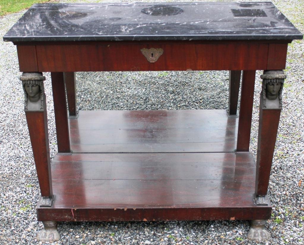 EGYPTIAN REVIVAL PIER TABLE, MAHOGANY: VENEER, 19TH CENTURY, MIRRORED BACK, 1 DRAWER, RECTANGULAR TOP SUPPORTED BY METAL CARYATID FIGURES, METAL ANIMAL FEET, 35” HIGH, 42 ½” WIDE, 21 ¾” DEEP, MINOR VENEER DAMAGE, REPLACED MIRROR