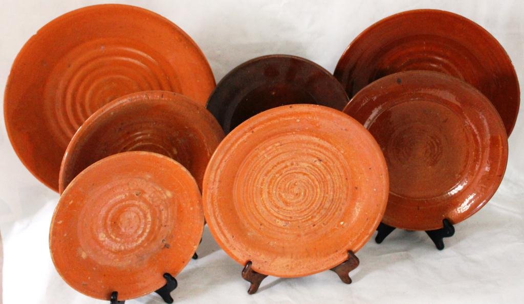 LOT OF 7 PIECES OF JUGTOWN POTTERY INCLUDING: BEN OWEN PLATTERS AND PLATES FROM 9” TO 13 ¾” DIAMETER, SOME MINOR NICKS