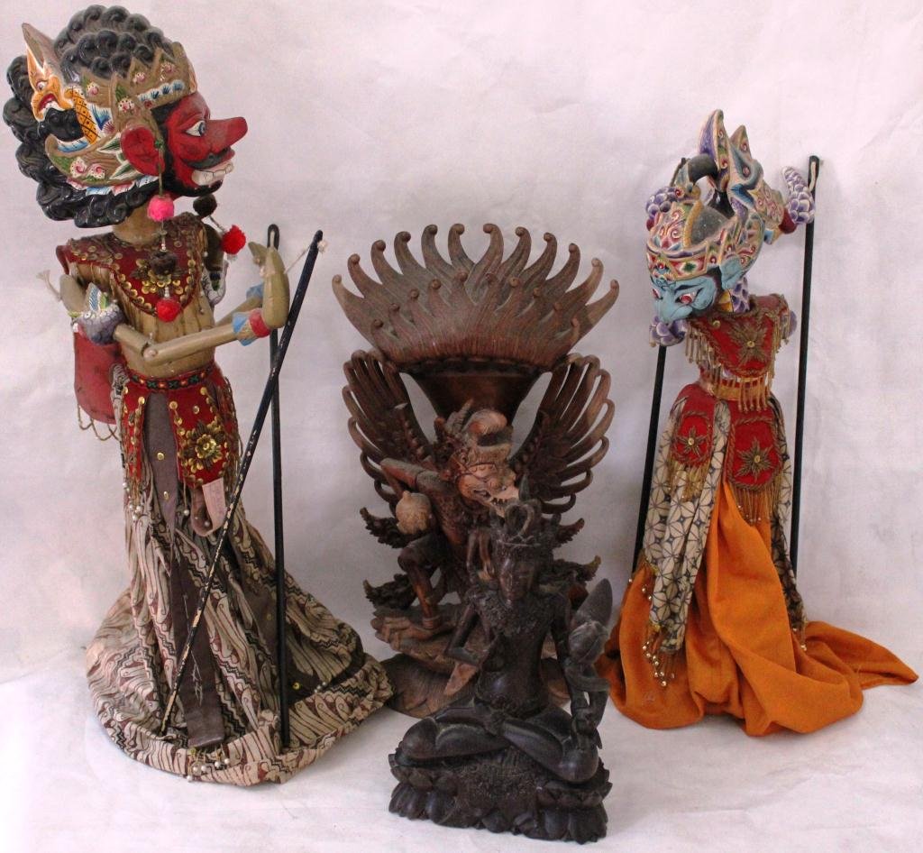 4 BALINESE ITEMS INCLUDING 2 CARVED: WOODEN GODS, 20TH CENTURY, 1 IS 17 ½” HIGH, 1 11 ½” HIGH ALONG WITH 2 HAND CARVED PUPPETS, 20TH CENTURY, 23 ½” X 19 1/2'”