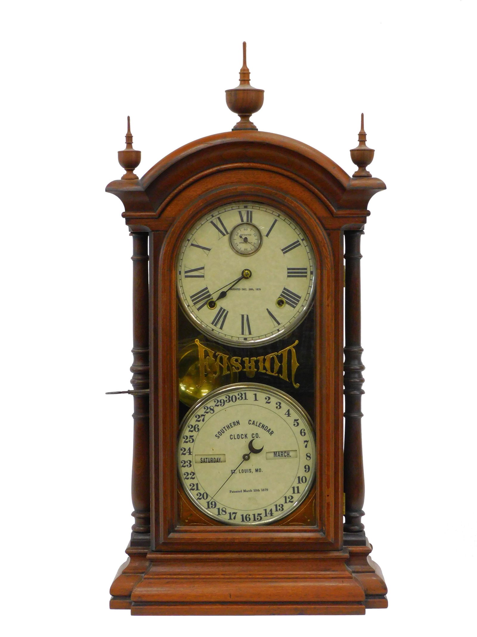 Southern Calendar Clock Co. Fashion. Late 19th: century. Double-dial clock made in St. Louis, MO. Walnut case with a Seth Thomas works, 8-day movement. 32 1/2" high by 16" w by 5 3/4" deep. Good overall condition.
