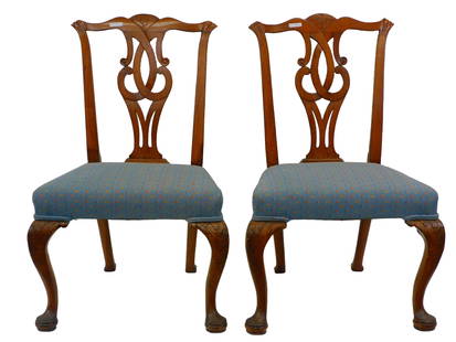 Pair of Queen Anne Transitional Side Chairs.: 1750-75. A pair of mahogany side chairs possibly Salem. The chairs have carved ears, leaf carved rail cut open work. Carved cabriole legs, terminating in a carved pad foot. New upholstery. 38" high by